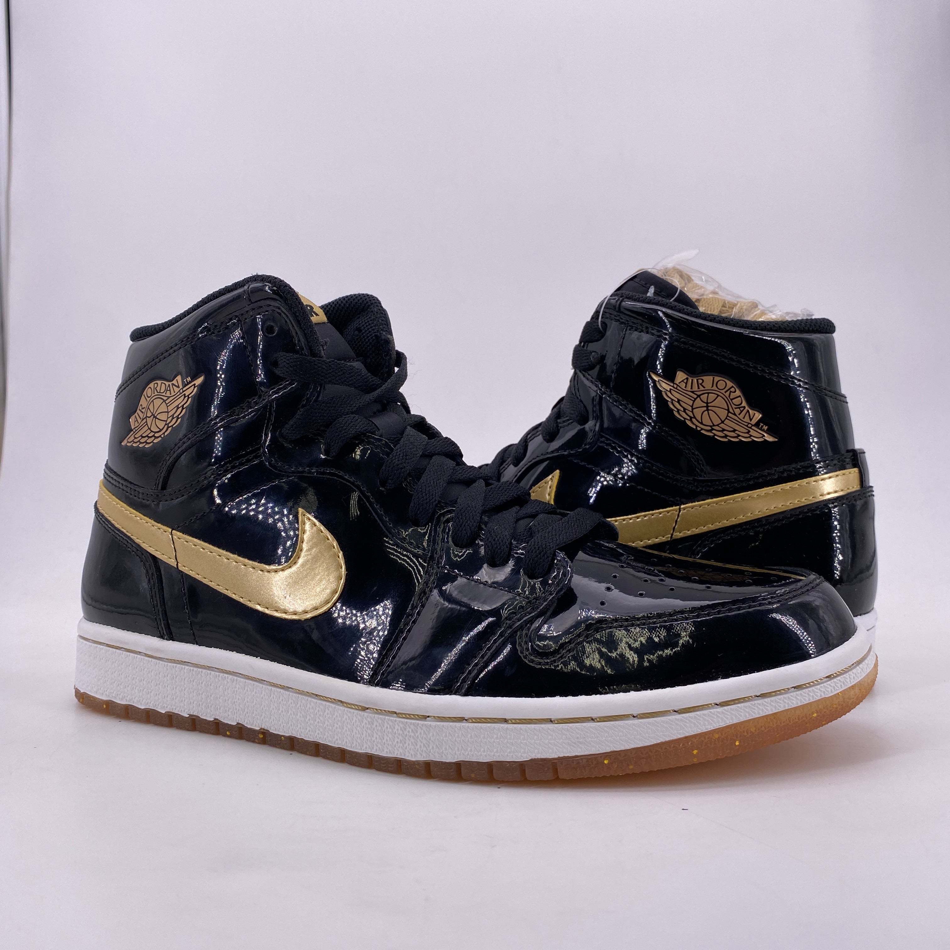 Jordan 1 retro high og black and gold on sale